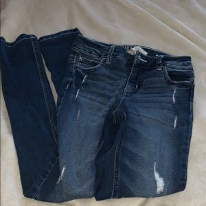 dark blue jeans with little pattern on back